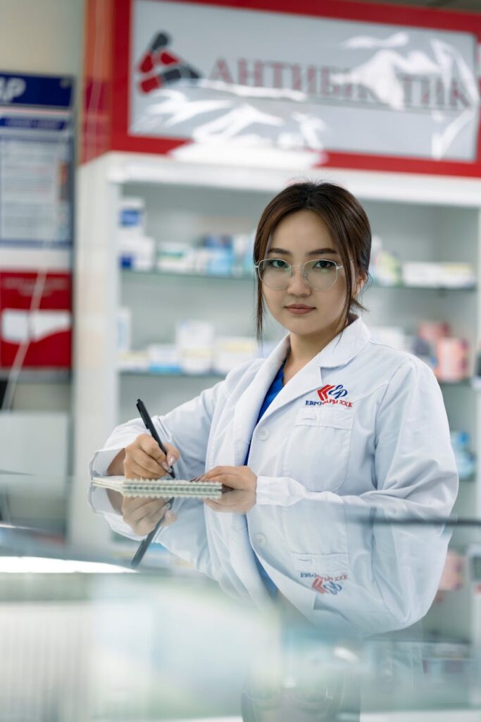 young pharmacist writing notes
