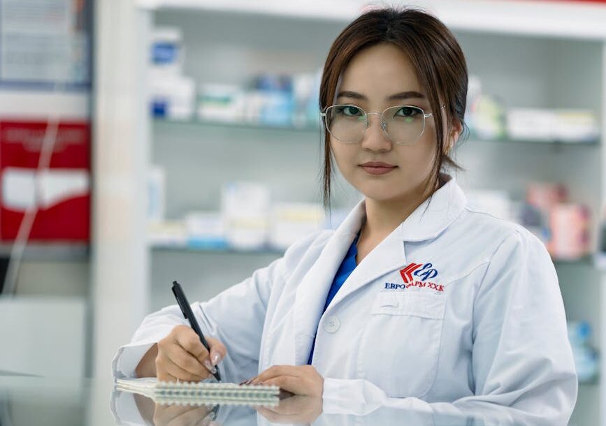 young pharmacist writing notes