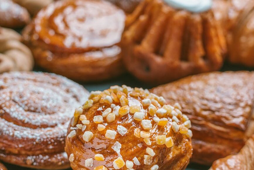 delicious fresh pastries on black table